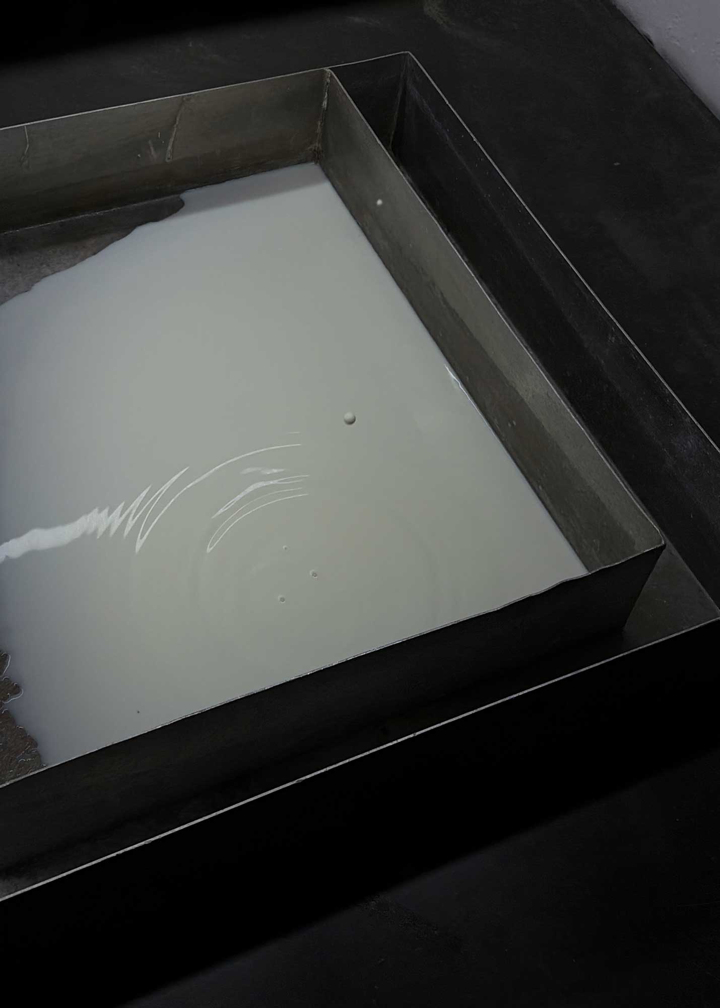 Luka Berchtold - drip drip drip (with Love from Harriet), 2026, 36 liters of melting frozen infant formula, 2 metal tubs, fan noise, letter (c) Luka Berchtold